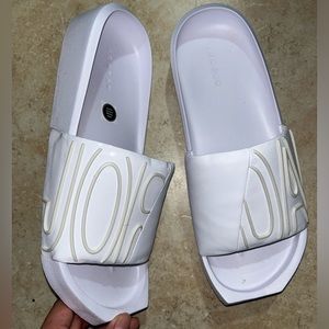 White Nike Jordan slides